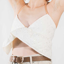 Load image into Gallery viewer, Cream quilted backless bralette with orange elasticated straps at neck and back. 
