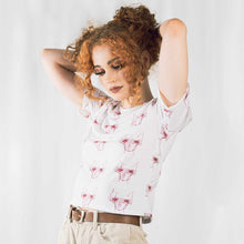 Load image into Gallery viewer, Fashion model wearing illustrated print of pink pig on a white jersey short sleeved T-Shirt.
